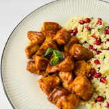 Свинина в соусе барбекю с кускусом, гранатом и мятой