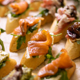 Праздничный сет брускетт: с грушей и камамбером, с лососем и хамоном